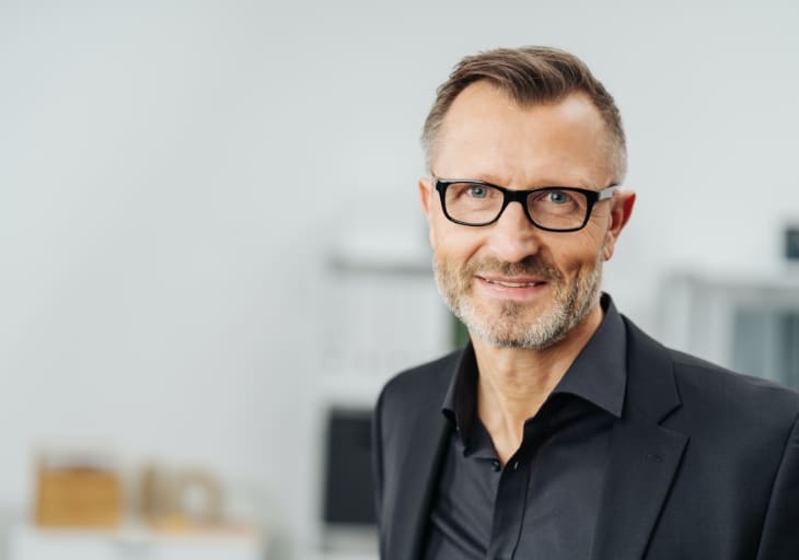Middle aged businessman wearing glasses Scandinavian Executive
